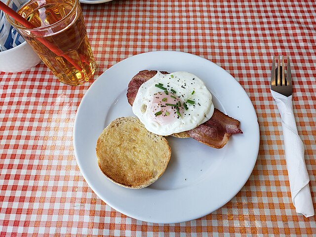 Toasted English muffin with fried egg and bacon: Credit, Wikimedia Commons Egg cuisine gets even more expensive in U.S. 2025