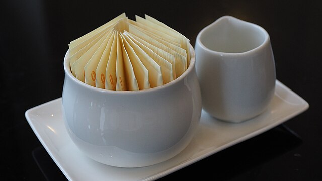 sugar in packets: Credit Wikimedia Commons Repackaged sugar like these sell in Kenya